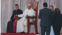 Pope Francis listens as Humberto and Claudia Gomez, who are married civilly but not in the church, speak during a meeting with families at the Victor Manuel Reyna Stadium in Tuxtla Gutierrez, Mexico, Feb. 15. (CNS photo/Paul Haring)
