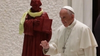 Oct. 13, 2016, Pope Francis passes by a statue of Martin Luther at an audience with Lutheran pilgrims at the Vatican